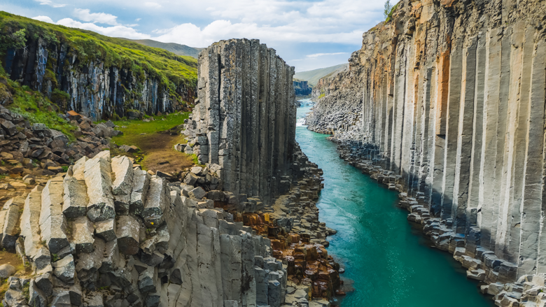 Icelandic river and very high cliffs